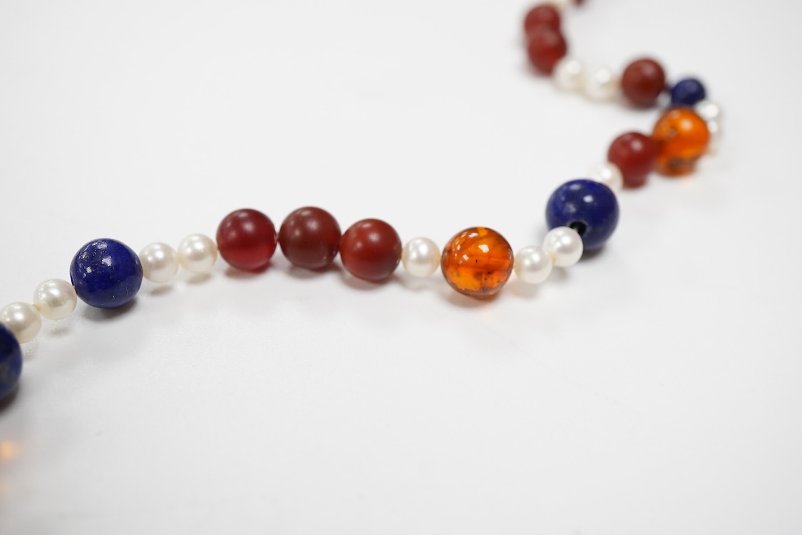 A 20th century Italian lapis lazuli, amber and pearl bead necklace (pearls no tested), with 925 clasp, 124cm.
